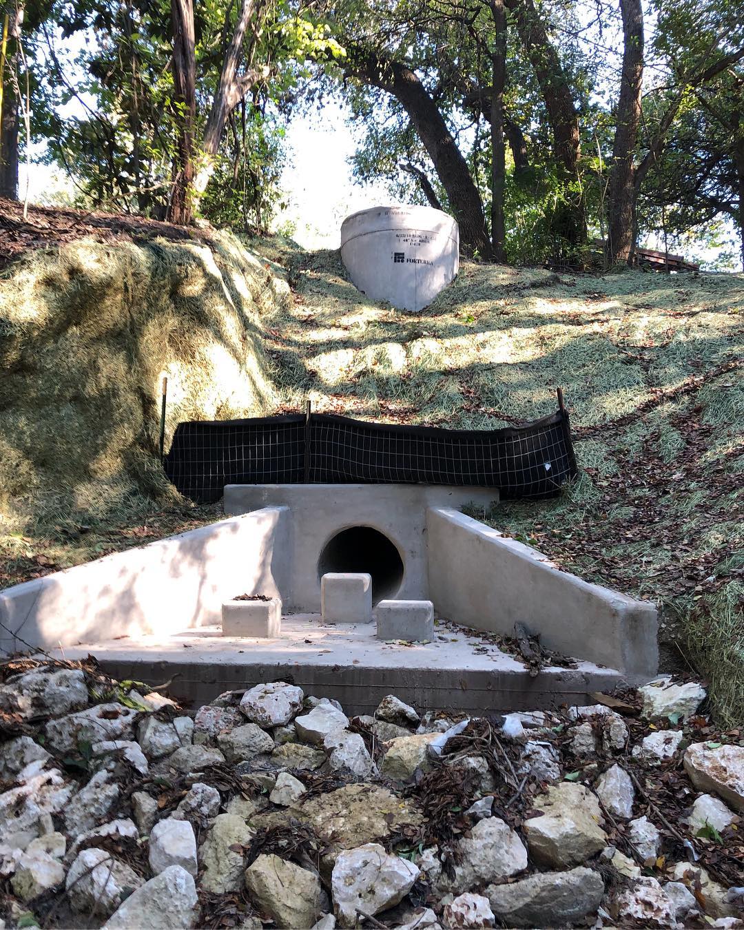 A triangular structure that directs stormwater onto rocky forest ground where it can be safely absorbed.